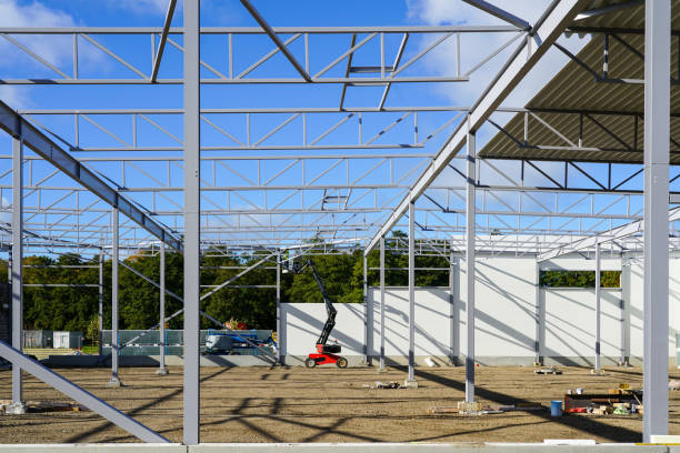 istock New building steel framework assembly using self propelled scissor lift 1454039415