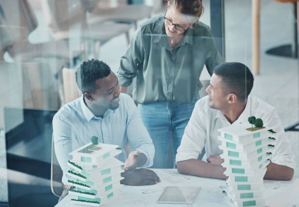 istock Architecture, 3d building and engineer people meeting for business industrial planning, model analysis or b2b project collaboration. Teamwork, ideas and construction infrastructure office discussion 1454039806