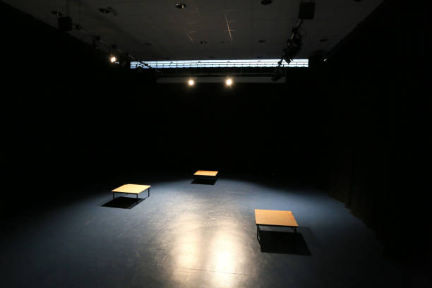 empty and dark black spotlit areas modern theater school drama performance space with