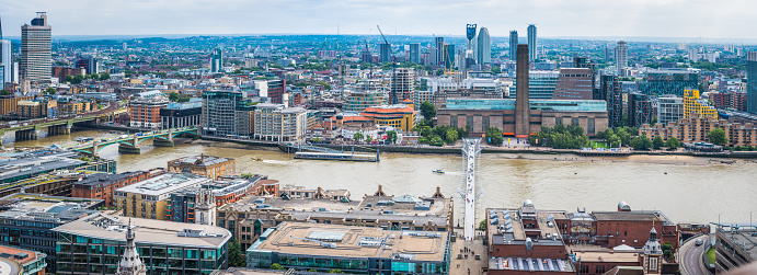 Aerial panorama along the River Thames, from Southwark Bridge past  The Globe theatre, Tate Modern and Millennium Bridge.