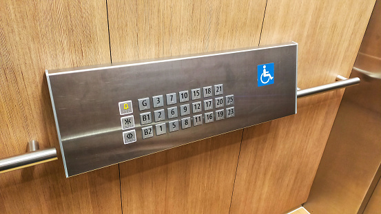 The disabled elevator button or panel with braille code of the elevator.