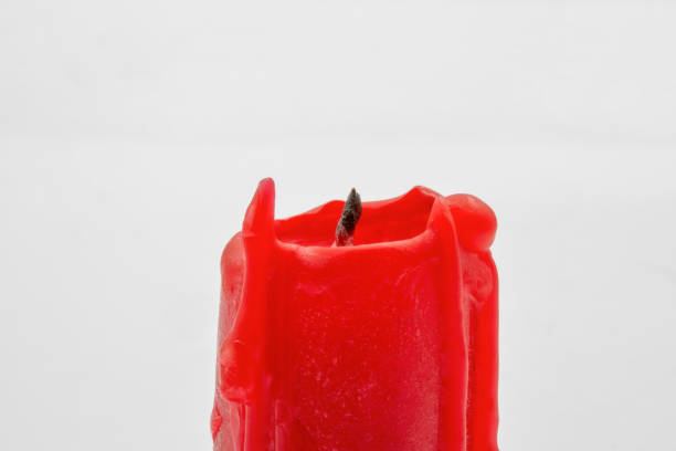 istock red candle stub closeup on white 1454044425