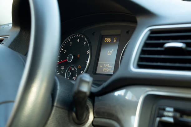 istock speedometer and steering wheel in auto close up 1454044473