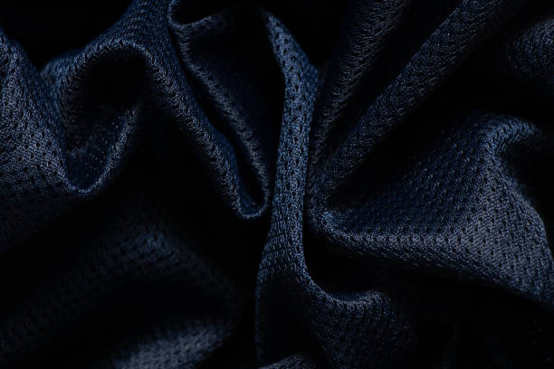istock dark blue fabric wrinkled as background close up 1454044522