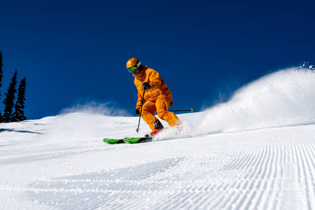 istock Skiing groomed runs in the mountains 1454045388