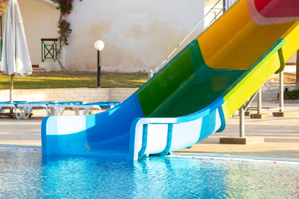 istock slide in the pool on a sunny summer day 1454045850