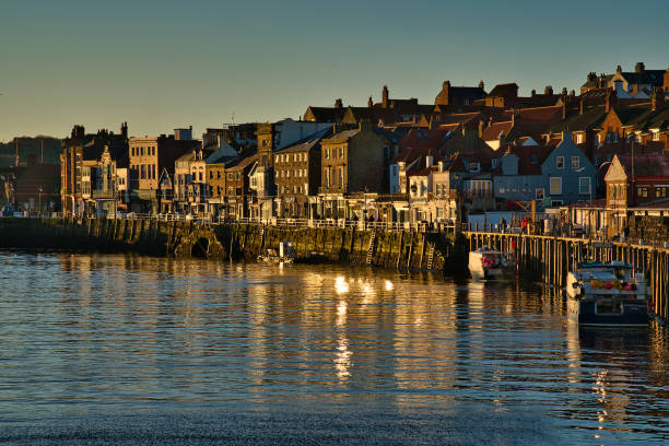 istock Harbour side architecture in early morning sunlight, Whitby, North Yorkshire, England, Britain 1454046923