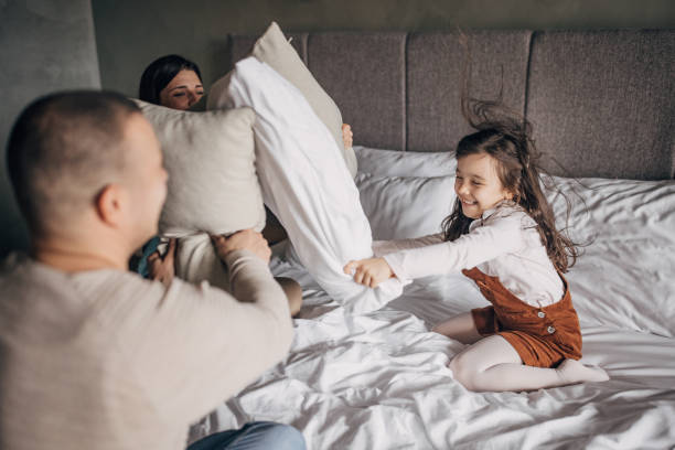 istock Pillow fight in hotel suite 1454050514
