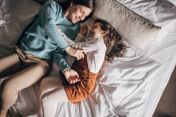 istock Mom and daughter in hotel room 1454051925