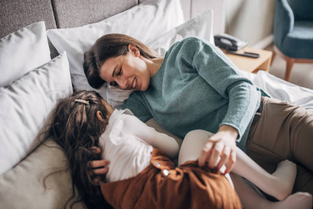 istock Mother and daughter in hotel room 1454051931
