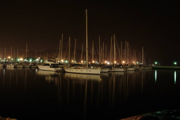 istock Boats moored in the harbor at night 1454052145