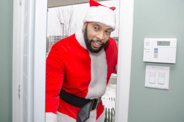 Black Santa Black Santa entering home through front door