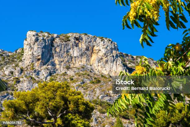 Alpes Mountains And Rocky Cliffs Over Eze Sur Mer Resort Town On French Riviera Coast Of Mediterranean Sea In France Stock Photo - Download Image Now