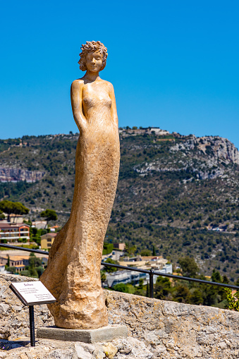 Eze, France - August 1, 2022: Goddess Barbara sculpture by Jean-Philippe Richard in Exotic Botanic Garden Le Jardin de Exotique on top of historic town of Eze at Mediterranean Sea