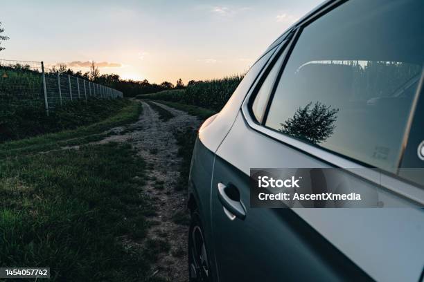 Detail Of Electric Vehicle In A Corn Field At Dusk Stock Photo - Download Image Now - Agricultural Field, Alternative Fuel Vehicle, Black Color