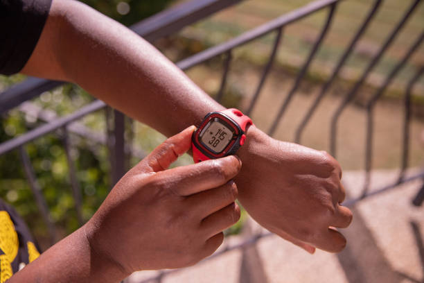 istock A black woman is timing her running using her sportwatch  after that she's finished practicing sports 1454059015
