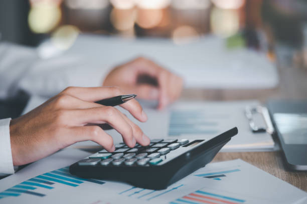 istock Business people read business statistics chart reports, to analyze and improve corporate strategy, manage financial and marketing documents, update annual budget accounts, company growth data. 1454060252