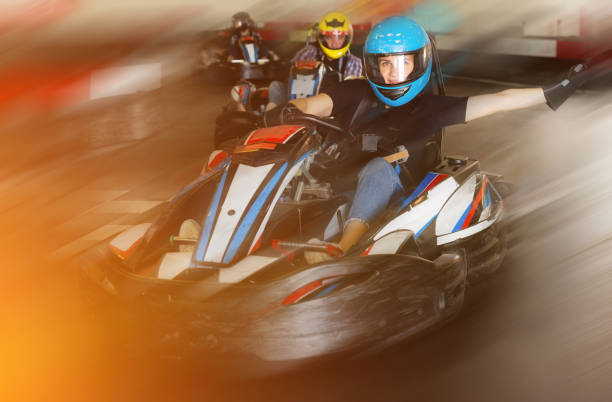 istock People driving go-kart cars 1454060954