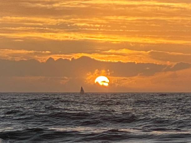 istock Sunrise w/ sailboat 1454061580