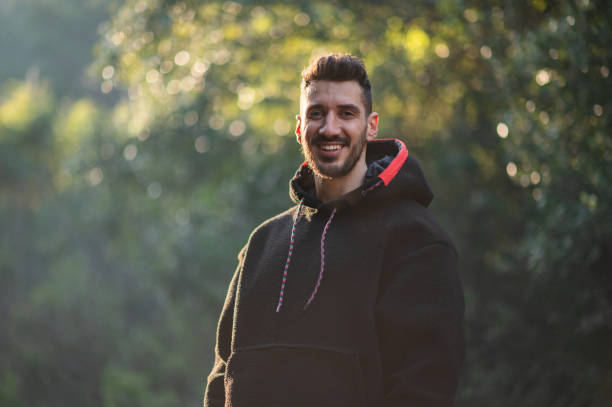 istock Portrait of young handsome man resting while exercising 1454062636
