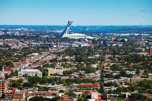 Montreal, Quebec, Canada - Olympic Stadium as seen from the Mount Royal lookout over the town.