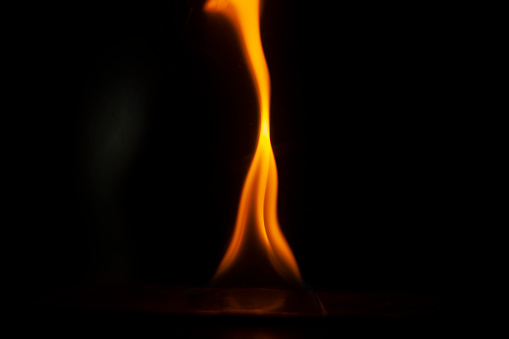 Flames in dark. One flame on black background. in Moscow, Moscow, Russia