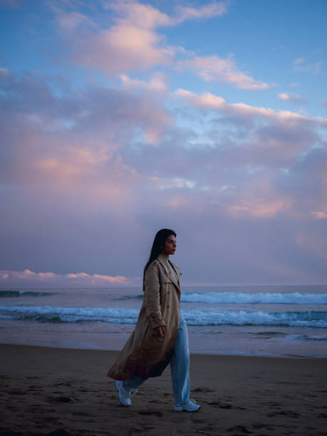 istock Young free Woman walking on the Atlantic Ocean 1454071252