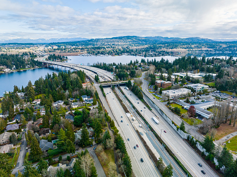 An aerial view of a bridge which also contains landscaping to encourage a wildlife corridor.  This bridge was intentionally made large than necessary for the road in order to have plantings.  This bridge is located on Mercer Island in Washington State.