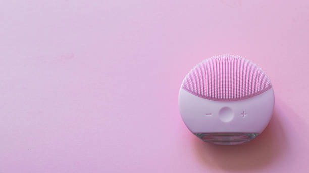 istock Beauty cleansing gadget  on pink background.Copy space,banner 1454073152