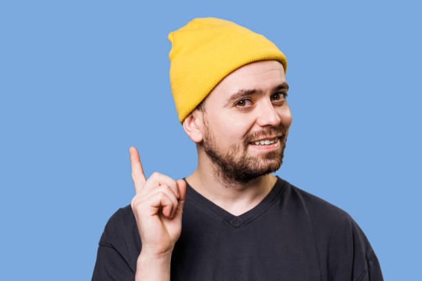 istock a confused fearful Man shocked looking at camera with hands on face 1454073612