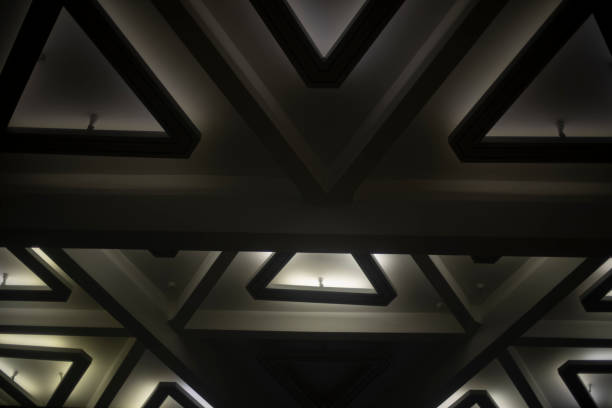 istock Light of lamps on ceiling. Architecture details. Triangles in building. 1454073811