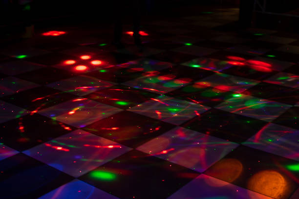 istock Disco dance floor. Light on dance floor. Colored spots on floor. Lights from spotlight. 1454074418