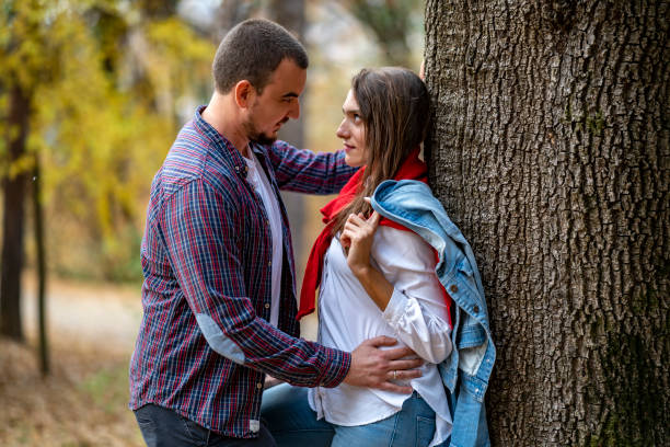 Beautiful young couple on date in the park during the day