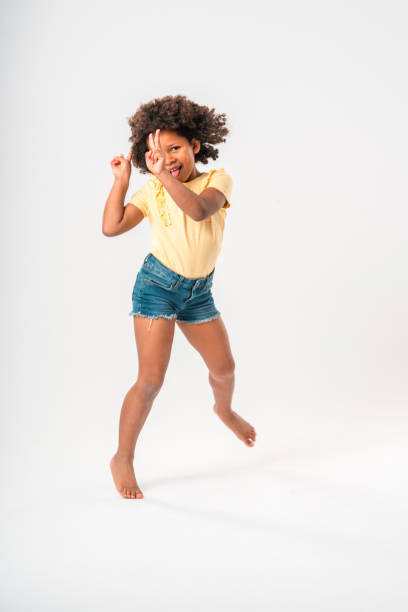 istock Little Afro-American Girl Dancing 1454075570
