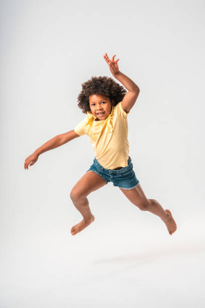 istock Cute Little Caribbean Girl Dancing 1454075571