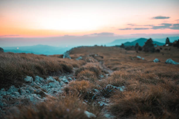 Sunglasses lying on backpack on mountaintop