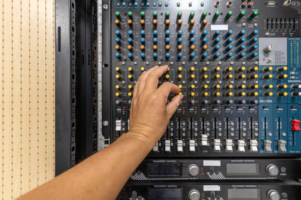 istock A hand for adjusting the audio mixer buttons 1454078179