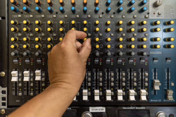 istock A hand for adjusting the audio mixer buttons 1454078223