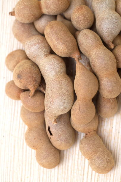 istock Indian tamarind fruit on the table close up 1454078551