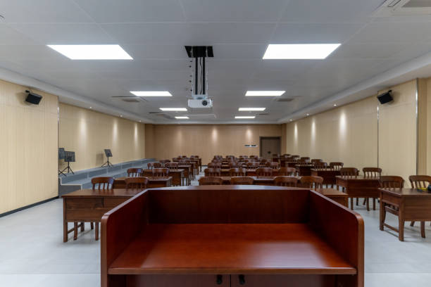 istock Piano and projection screen on the platform of an empty multimedia music training classroom 1454078969
