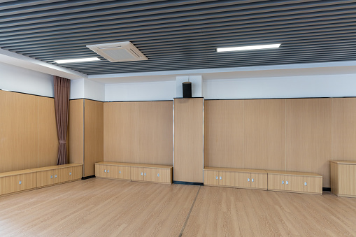 Wood floor, wall and cabinets in the empty dance room