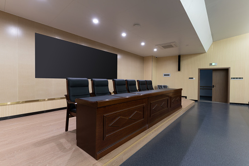 The rostrum of an empty and bright conference room