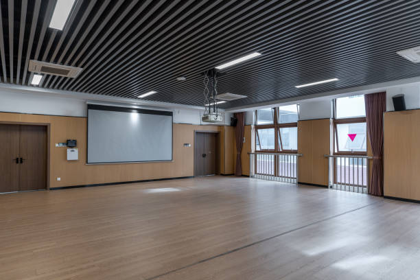 istock Projection screen and wooden floor of empty dance classroom 1454080070