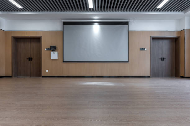 istock Projection screen and wooden floor of empty dance classroom 1454080174