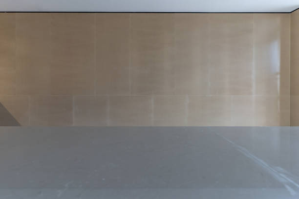 An empty lobby reception area with tiled floors and walls