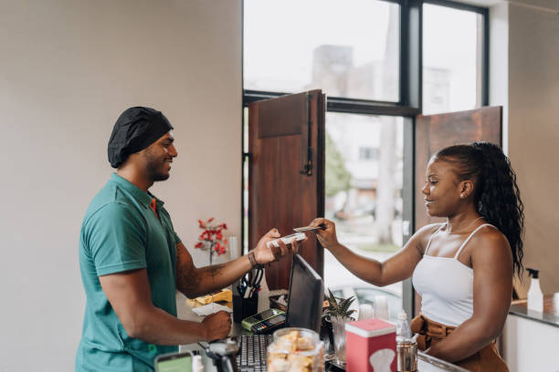 istock Woman at bistro checkout counter 1454083923