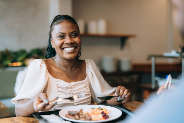 istock Woman having lunch at the restaurant 1454083984