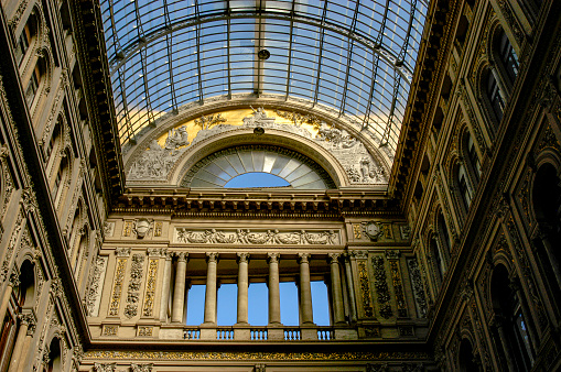 Galleria Umberto I of Naples, Italy is a historic landmark turned into a galleria shopping center with businesses, shops, cafes, and social gathering spaces.