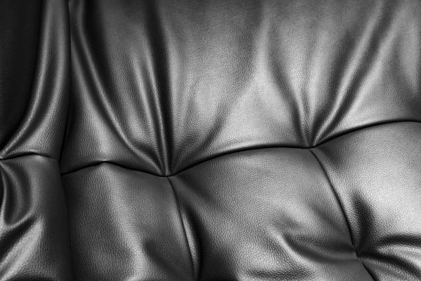 Soft leather sofa surface Soft leather sofa surface leather cushion stock pictures, royalty-free photos & images