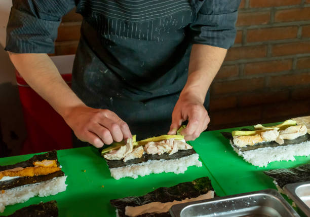 istock Placing ingredients on the sushi 1454087510